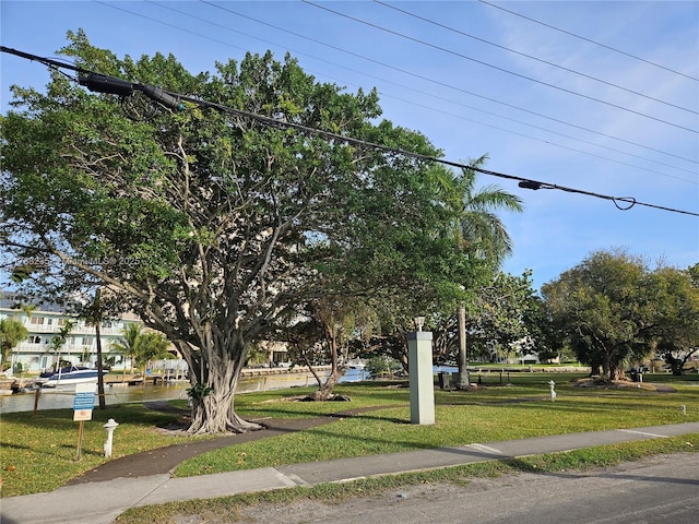 250 Layne Blvd Unit 105, Hallandale Beach, FL 33009 - view of home's community featuring a lawn