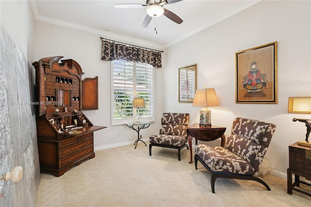 living area with crown molding, carpet flooring, a ceiling fan, and baseboards