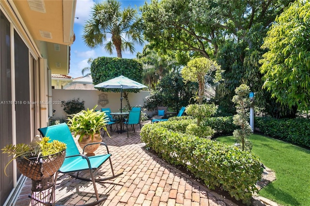 view of patio / terrace featuring fence