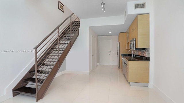 60 SW 13th St Unit 3820, Miami, FL 33130 - stairway with baseboards and tile patterned flooring