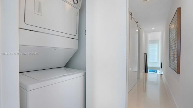 60 SW 13th St Unit 3820, Miami, FL 33130 - washroom featuring stacked washer and clothes dryer, light tile patterned floors, and recessed lighting