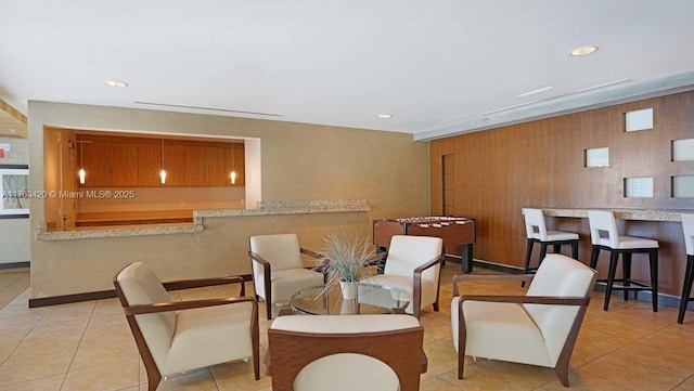 60 SW 13th St Unit 3820, Miami, FL 33130 - living area featuring tile patterned flooring, recessed lighting, and wood walls