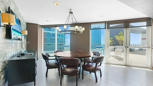 60 SW 13th St Unit 3820, Miami, FL 33130 - dining space with a chandelier, a wall of windows, and light tile patterned flooring