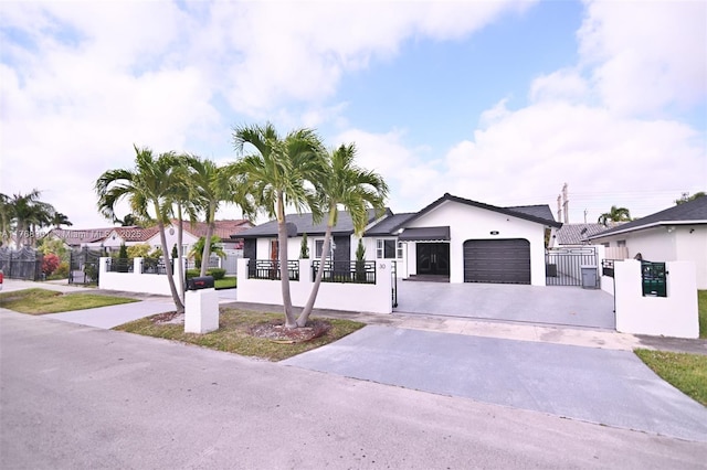 30 SW 136th Ave, Miami, FL 33184 - single story home featuring an attached garage, a fenced front yard, and concrete driveway