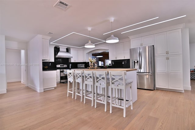 30 SW 136th Ave, Miami, FL 33184 - kitchen featuring white cabinets, visible vents, appliances with stainless steel finishes, and wall chimney exhaust hood