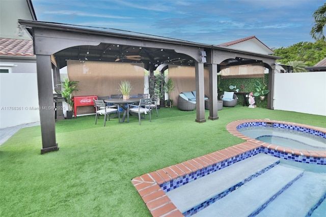 30 SW 136th Ave, Miami, FL 33184 - view of patio / terrace featuring an outdoor living space, an in ground hot tub, fence, and ceiling fan