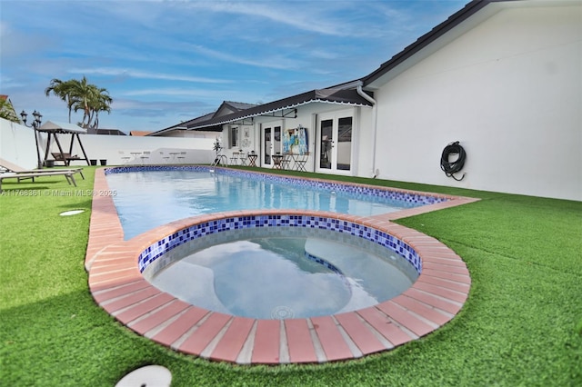 30 SW 136th Ave, Miami, FL 33184 - view of swimming pool featuring fence, french doors, a fenced in pool, an in ground hot tub, and a lawn