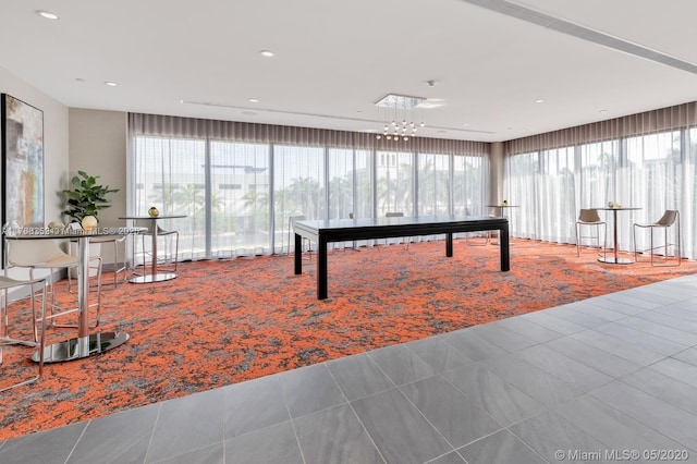 5350 NW 84th Ave Unit 1814, Doral, FL 33166 - recreation room featuring tile patterned flooring, carpet, and a healthy amount of sunlight