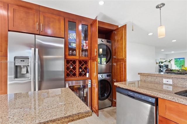 5717 NW 102nd Pl, Doral, FL 33178 - kitchen featuring decorative light fixtures, stacked washing maching and dryer, wine cooler, appliances with stainless steel finishes, and glass insert cabinets