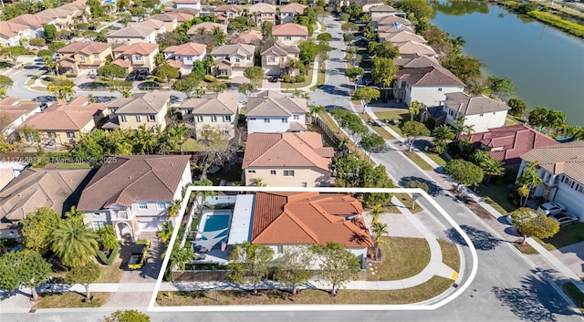 aerial view with a residential view and a water view