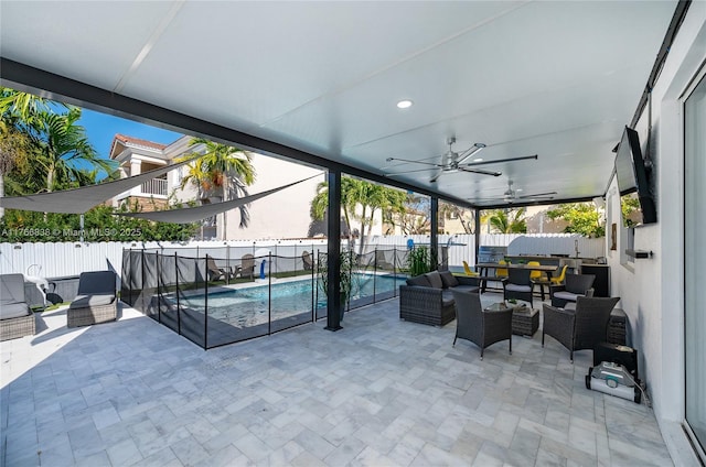 view of patio / terrace featuring a fenced in pool, outdoor lounge area, a fenced backyard, and a ceiling fan