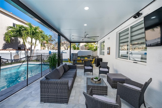 view of patio / terrace featuring an outdoor living space, a fenced backyard, a fenced in pool, and ceiling fan