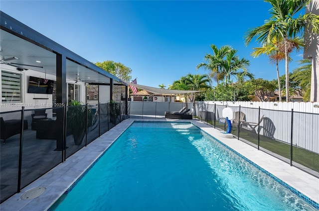 view of pool featuring a fenced backyard, a patio, a fenced in pool, and ceiling fan