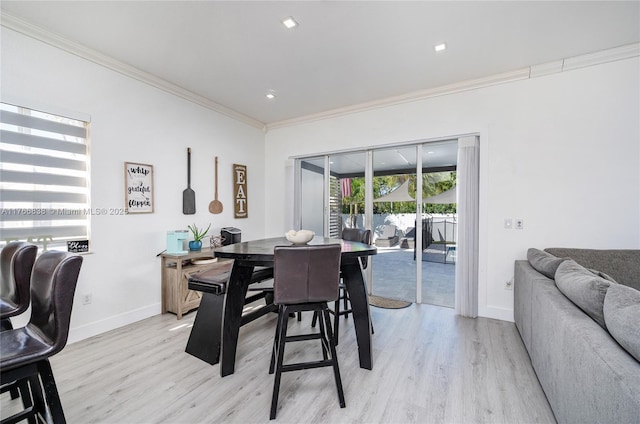 dining space with recessed lighting, baseboards, light wood-type flooring, and ornamental molding