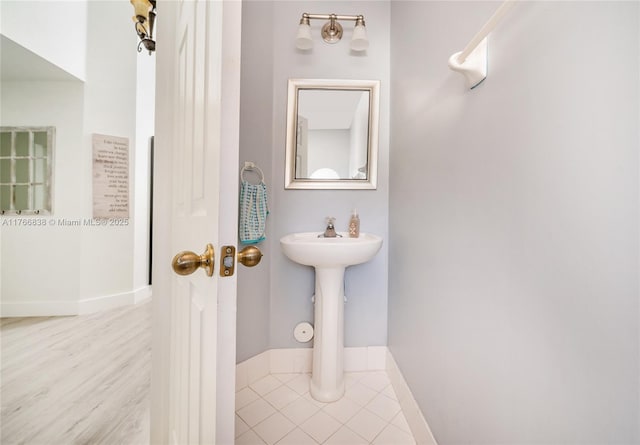 bathroom featuring tile patterned floors and baseboards