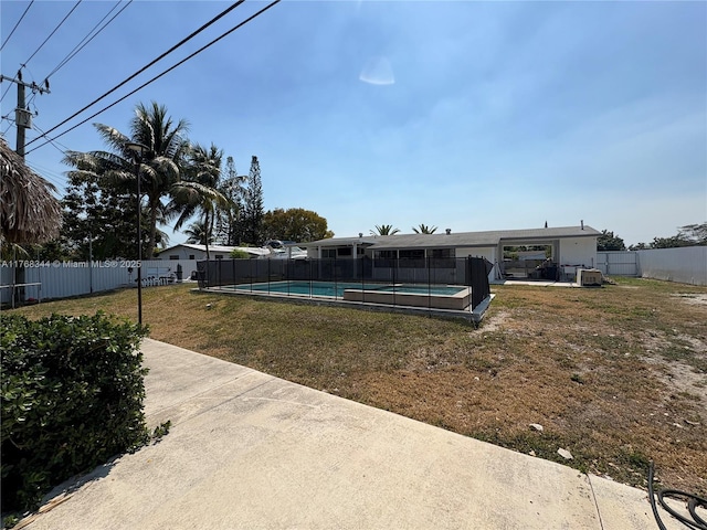 9545 SW 181st Ter, Palmetto Bay, FL 33157 - view of yard featuring a fenced in pool, a patio, and a fenced backyard