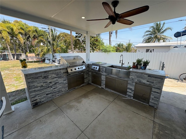 9545 SW 181st Ter, Palmetto Bay, FL 33157 - view of patio / terrace with area for grilling, ceiling fan, a fenced backyard, and a sink