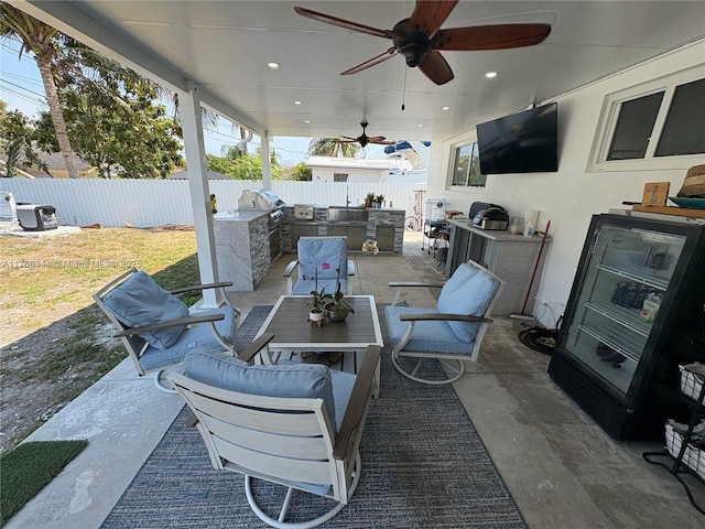 9545 SW 181st Ter, Palmetto Bay, FL 33157 - view of patio / terrace with area for grilling, a ceiling fan, exterior kitchen, and a fenced backyard