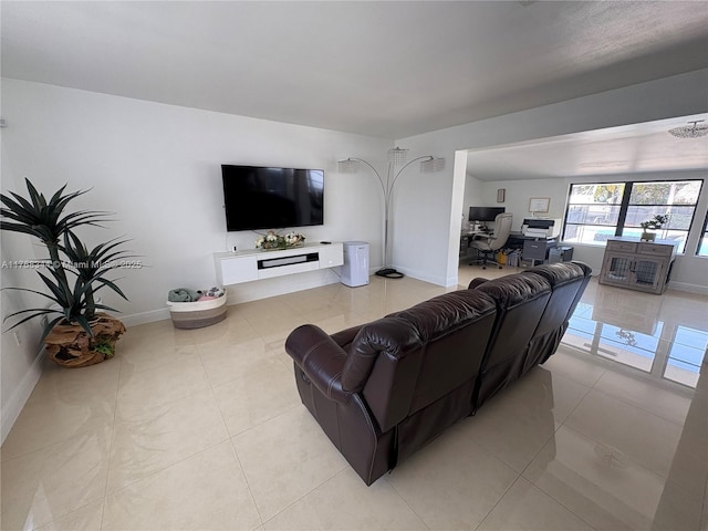 9545 SW 181st Ter, Palmetto Bay, FL 33157 - living room featuring light tile patterned floors and baseboards