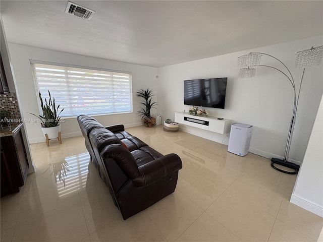 9545 SW 181st Ter, Palmetto Bay, FL 33157 - living room featuring light tile patterned floors, baseboards, and visible vents