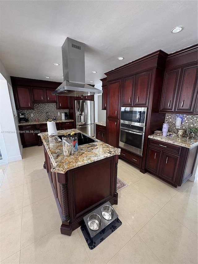 9545 SW 181st Ter, Palmetto Bay, FL 33157 - kitchen featuring light tile patterned floors, island exhaust hood, stainless steel appliances, dark brown cabinets, and a center island