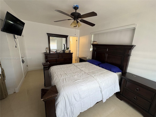 9545 SW 181st Ter, Palmetto Bay, FL 33157 - bedroom featuring light tile patterned floors, a ceiling fan, and baseboards