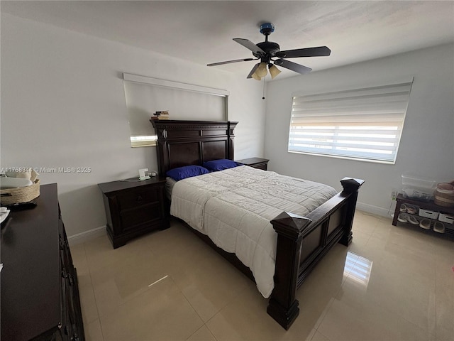 9545 SW 181st Ter, Palmetto Bay, FL 33157 - bedroom featuring light tile patterned floors, baseboards, and ceiling fan