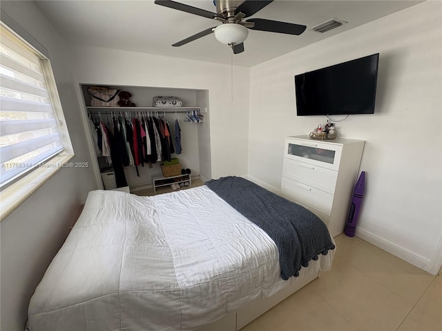 9545 SW 181st Ter, Palmetto Bay, FL 33157 - bedroom with visible vents, a ceiling fan, a closet, tile patterned flooring, and baseboards