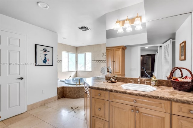 6400 Marlin Dr, Coral Gables, FL 33158 - full bath featuring tile patterned flooring, a garden tub, vanity, and baseboards