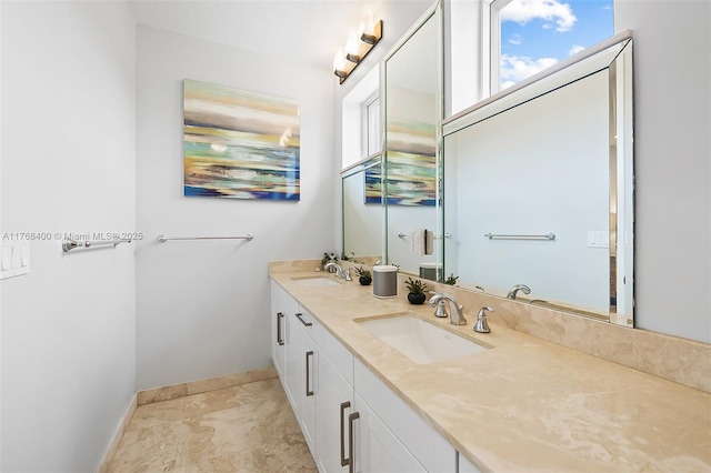 306 NE 8th Ave Unit 306, Fort Lauderdale, FL 33301 - full bathroom featuring double vanity and baseboards