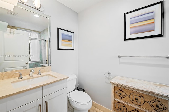 306 NE 8th Ave Unit 306, Fort Lauderdale, FL 33301 - bathroom with toilet, vanity, a shower stall, and baseboards