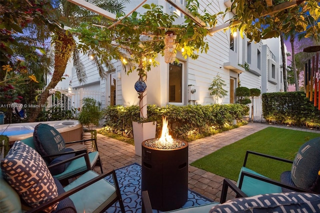 306 NE 8th Ave Unit 306, Fort Lauderdale, FL 33301 - view of patio featuring a fire pit and a hot tub
