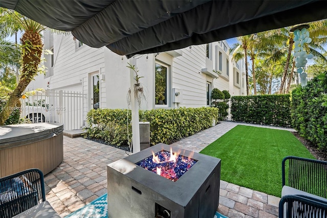 306 NE 8th Ave Unit 306, Fort Lauderdale, FL 33301 - view of patio with a hot tub and a fire pit