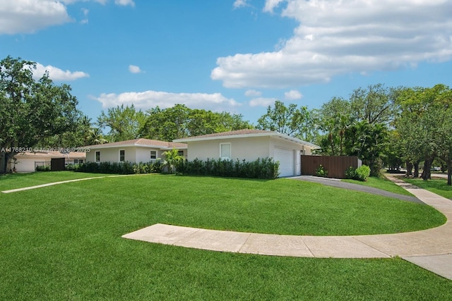 7640 SW 165th Ter, Palmetto Bay, FL 33157 - single story home with driveway, stucco siding, fence, a front lawn, and a garage