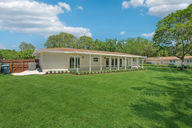 7640 SW 165th Ter, Palmetto Bay, FL 33157 - rear view of house featuring cooling unit, stucco siding, fence, and a yard