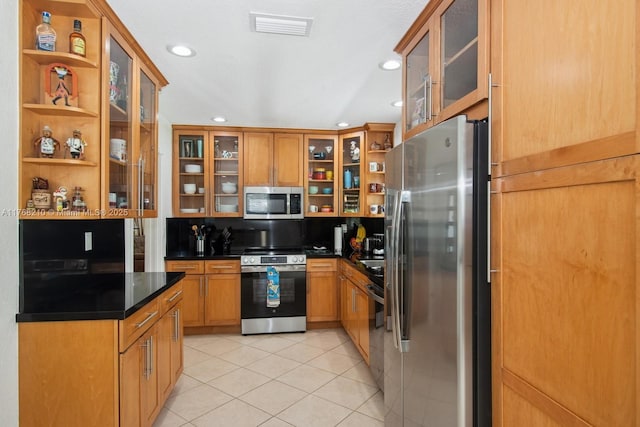7640 SW 165th Ter, Palmetto Bay, FL 33157 - kitchen featuring open shelves, appliances with stainless steel finishes, dark countertops, light tile patterned floors, and visible vents