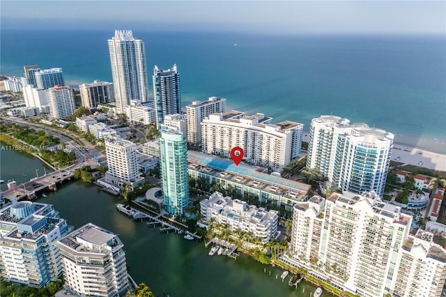 drone / aerial view featuring a water view and a city view