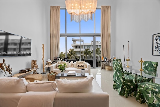 tiled living room featuring a notable chandelier