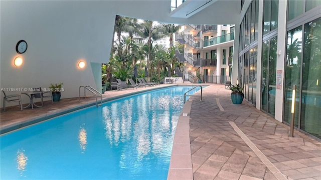 pool with a patio area