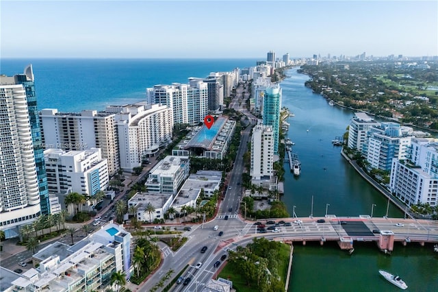 aerial view with a water view and a view of city