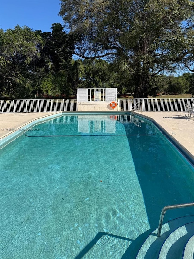 1201 NE 191st St Unit G313, Miami, FL 33179 - view of swimming pool with a fenced in pool, a patio, and fence