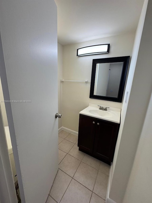 1201 NE 191st St Unit G313, Miami, FL 33179 - bathroom with baseboards, vanity, and tile patterned flooring