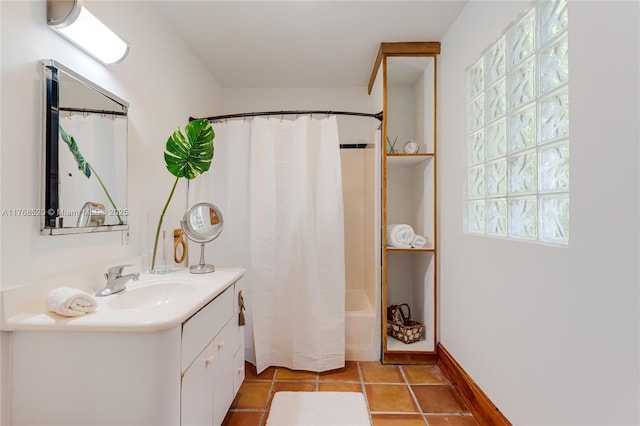 bathroom with tile patterned floors, baseboards, shower / bath combo, and vanity