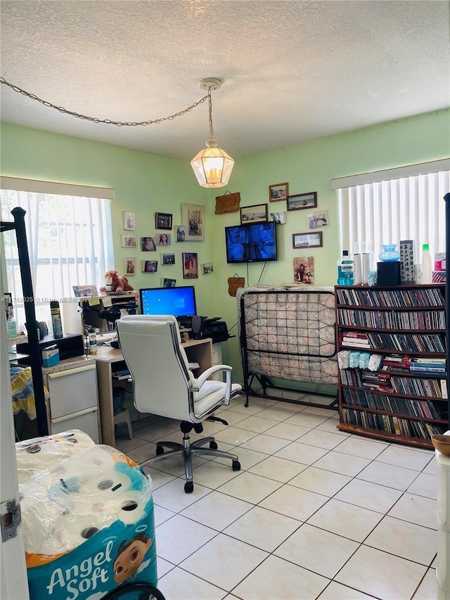 office space featuring light tile patterned floors and a textured ceiling