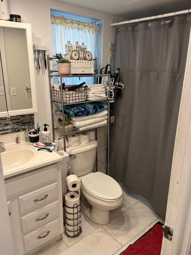 8101 N Sunrise Lakes Dr Unit 105, Sunrise, FL 33322 - bathroom with vanity, tile patterned flooring, a shower with shower curtain, and toilet