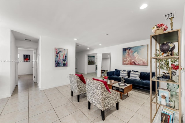 living room with light tile patterned flooring, visible vents, recessed lighting, and baseboards