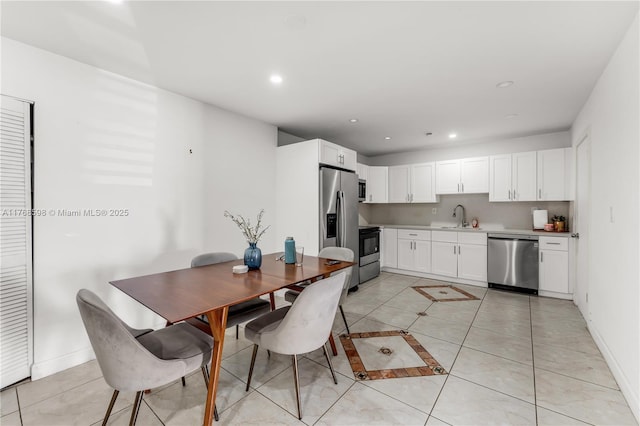 dining room featuring light tile patterned floors, baseboards, and recessed lighting