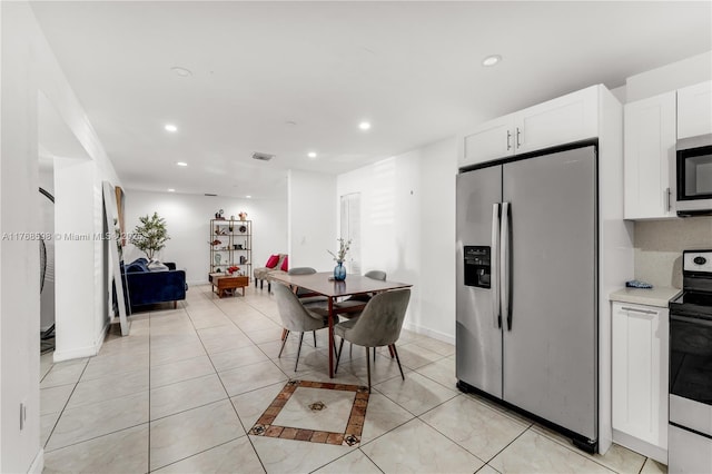 dining area featuring recessed lighting, visible vents, baseboards, and light tile patterned floors