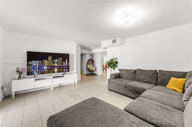 living area featuring light tile patterned floors and visible vents