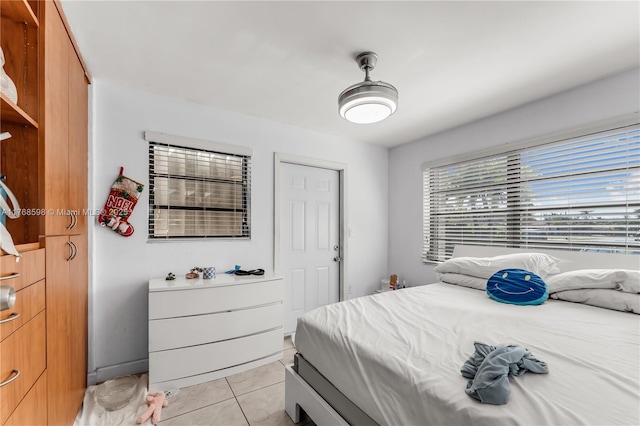bedroom featuring light tile patterned flooring